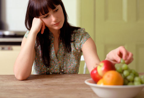 getty_rm_photo_of_woman_picking_at_food